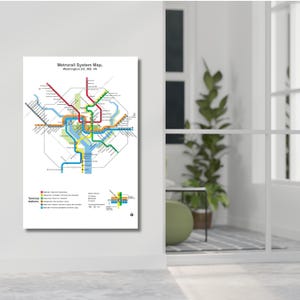 May include: A white wall art print featuring the Metrorail System Map of Washington DC, MD, VA. The map displays colorful transit lines including red, green, orange, blue, yellow, and silver, with a legend for terminal stations and symbols.