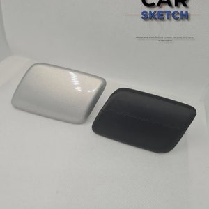 Puede incluir: Dos piezas de coche, una plateada y otra negra, se muestran sobre una superficie blanca. Las piezas son ambas rectangulares y tienen una forma ligeramente curvada. El texto "CAR SKETCH" es visible en la esquina superior derecha de la imagen.