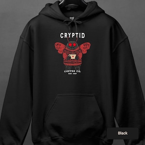 a black hoodie with a picture of a skull on it