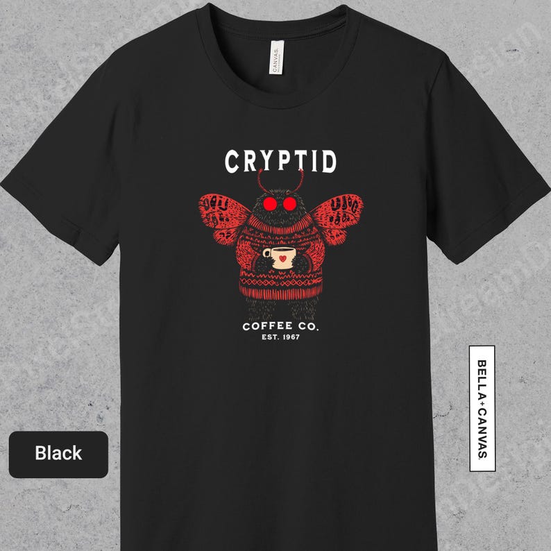 a black t - shirt with a picture of a cup of coffee on it