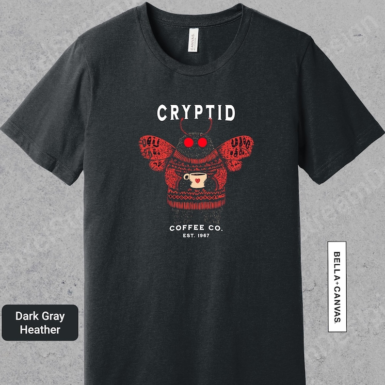 a black t - shirt with a picture of a cup of coffee on it