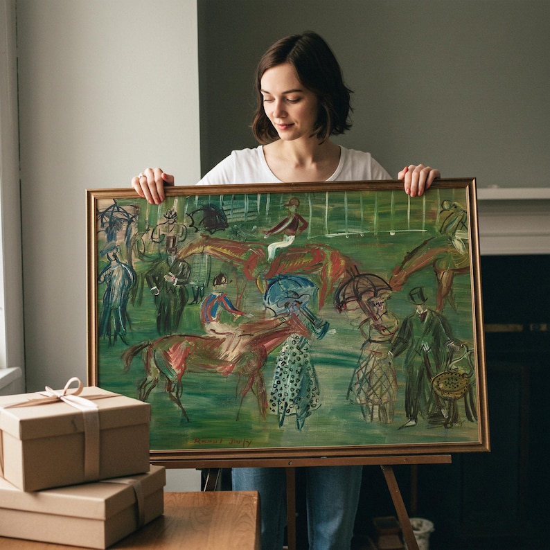 May include: An oil painting in a gold frame depicts a horse race scene with figures and horses in motion. The artwork features a green background with red, blue, and brown hues. The painting is held by a person.
