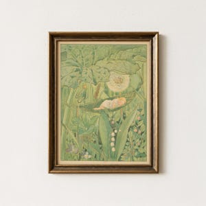 May include: A framed illustration featuring a small figure sleeping in a hammock made of a leaf, surrounded by large green foliage, a dandelion seed head, and lily of the valley flowers. The artwork is enclosed in a dark brown wooden frame.