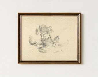 May include: A framed pencil sketch on cream-coloured paper featuring a cottage and a tree. The artwork is enclosed in a dark brown wooden frame with a decorative embossed border surrounding the central landscape illustration.