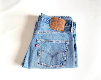 W30 vintage Levi's 501 (tag 31x32, actual 30x32). Light blue, Made in USA.
