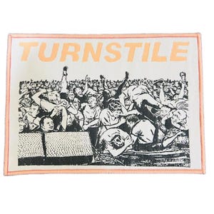 May include: Rectangular patch featuring the word "TURNSTILE" in orange block letters above a black and white illustration of a crowd. The patch has a peach-coloured border.