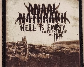 May include: Square patch with a black border. The patch features the band name "Anaal Nathrakh" in a gothic font, and the text "Hell is Empty and All the Devils are Here". The background is a sepia-toned landscape with a ruined building.