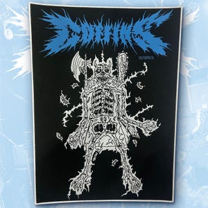 May include: A rectangular black fabric patch featuring a white graphic illustration of a skeletal figure holding an axe and a chainsaw. The text COFFINS is printed in a jagged blue font at the top, with 783MERCH written in smaller blue text below.
