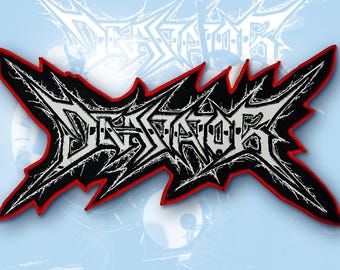 May include: A fabric patch featuring the word DEVASTATOR in a stylised, jagged, black and white metal-style font. The lettering is set against a black background with a sharp, angular border outlined in a vibrant red thread.