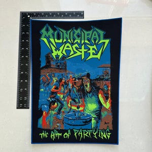 May include: A rectangular patch with a black border featuring the text "MUNICIPAL WASTE" in green and yellow, above a colorful illustration of a crowd. The phrase "THE ART OF PARTYING" is printed at the bottom. The patch measures approximately 10 inches by 8 inches.