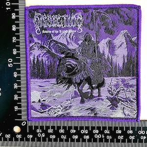 May include: A purple and black embroidered patch featuring a grim reaper riding a horse through a mountainous landscape. The patch has the band name "Dissection" and the text "Storm of the Light's Bane".