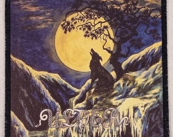 May include: Square patch featuring a wolf howling at a full moon. The design includes a tree, mountains, and the word "ULVER" in a stylized font. The color palette is dominated by blues, yellows, and blacks.