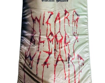 May include: A rectangular flag with the text "Electric Wizard" at the top. The word "WIZARD" is written in dripping red letters. The flag has grommets in the corners.