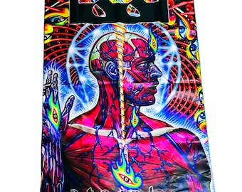 May include: A vibrant tapestry featuring a detailed anatomical illustration of a human head and torso, with exposed muscles and veins. The design incorporates psychedelic elements, including swirling patterns, eyes, and the band's logo "TOOL" at the top, with the word "Lateralus" at the bottom.