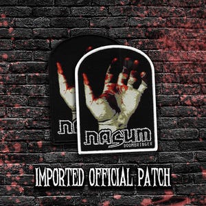 May include: Two black patches with a white border. Each patch features a hand with blood splatters and the text "nasum DOOMBRINGER". The text "IMPORTED OFFICIAL PATCH" is at the bottom.