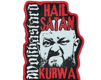 May include: A rectangular patch with a red border and a black background. The patch features a white and black image of a man's face with the words "HAIL SATAN KURWA" in red. The word "DISTURBO" is written vertically in white.