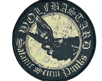 May include: Round black patch with a distressed cream-colored center. The patch features a black graphic of a bird and a hand giving the finger, surrounded by text. The text reads "Wolf Bastard" and "Satanic Scum Punks."