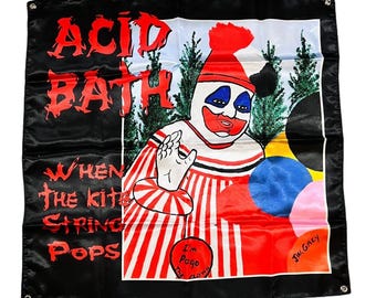May include: A black rectangular fabric banner featuring the text ACID BATH and WHEN THE KITE STRING POPS in red. The centre displays a clown with a red and white striped outfit, a red hat, and blue eye makeup, with a red circle reading I'm Pogo The Clown.