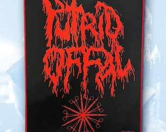 May include: Black rectangular patch with a red border. The patch features the words "PUTRID COFFIN" in a dripping, stylized font. Below the text is a red circular design made of surgical scissors. The text "783MERCH" is printed in the bottom right corner.