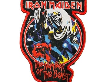 May include: Embroidered patch featuring the Iron Maiden band logo in red and white. The patch has a black background with a graphic of the band's mascot, Eddie, and the text "The Number of the Beast". The patch is outlined in red.