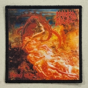 May include: Square patch with a detailed, fiery illustration. The artwork features figures in a hellish landscape with the band name "Morbid Angel" and the text "Blessed are the". The patch has a black border.