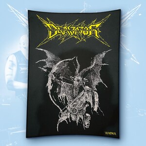 May include: A rectangular black fabric patch featuring a yellow stylized logo that reads DEVIATOR at the top. Below the text is a detailed white graphic illustration of a winged, horned creature holding a bow and arrow, with 783 MERCH printed in yellow.