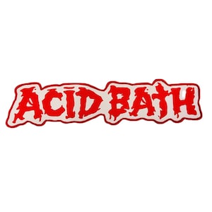 May include: A red and white sticker with the words "ACID BATH" in a bold, dripping font. The text is in red with a white outline, set against a white background. The sticker has a unique, irregular shape.