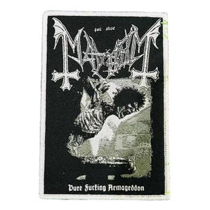 May include: Black and white patch featuring the band name "Mayhem" in a gothic font with inverted crosses and bat-like wings. The image includes the text "Pure Fucking Armageddon" and a grayscale illustration.