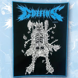 May include: A rectangular black fabric patch with a blue border featuring a white graphic illustration of a skeleton holding an axe and a chainsaw. The text "COFFINS" is printed in a jagged blue font at the top, with "783 MERCH" below it.