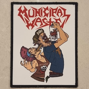 May include: Rectangular patch with the words "MUNICIPAL WASTE" in red, stylized lettering. The patch features a cartoon illustration of two figures, one drinking from a can labeled "OX", and the other vomiting. The word "BARF" is above one figure's head.