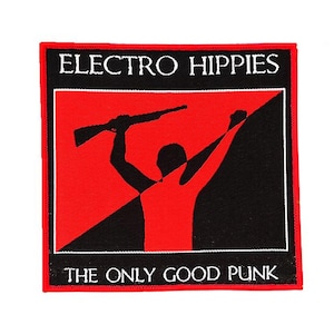 May include: Square patch with a red and black design. The patch features the words "ELECTRO HIPPIES" and "THE ONLY GOOD PUNK" in white text. A silhouette of a person holding a rifle is in the center.