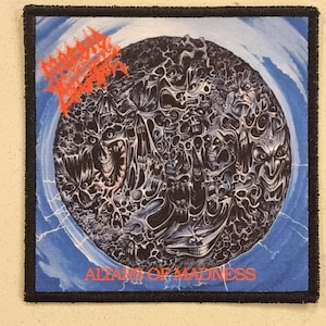 May include: A square patch with a black border features a detailed illustration of a dark, swirling mass of faces and figures. The text "ALTARS OF MADNESS" is at the bottom in red. The top left corner has a red, spiky logo.