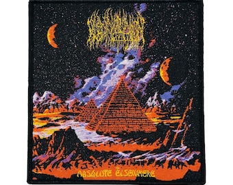 May include: Square patch with a design featuring pyramids, a starry night sky, and crescent moons. The patch has the text "ABSOLUTE ELSEWHERE" and a band logo in yellow. The colour palette includes orange, black, purple, and yellow.