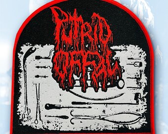 May include: A black patch with a red border featuring the text "PUTRID OFFAL" in red, dripping font. The patch has a white background with black medical tools. The patch is rectangular with a curved top.