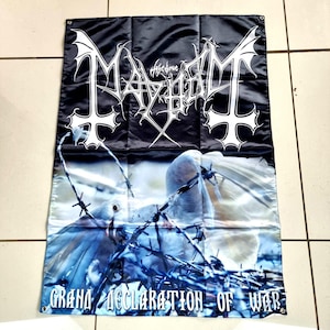 May include: Black banner with white gothic lettering spelling "Mayhem" and inverted crosses. The lower section depicts doves caught in barbed wire, with the words "Grand Declaration of War" in blue and white.