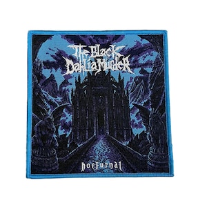 May include: A square patch with a blue border. It features the text "The Black Dahlia Murder" in white gothic lettering. The image shows a dark castle scene with a pathway leading to a gate, and the word "nocturnal" is at the bottom.
