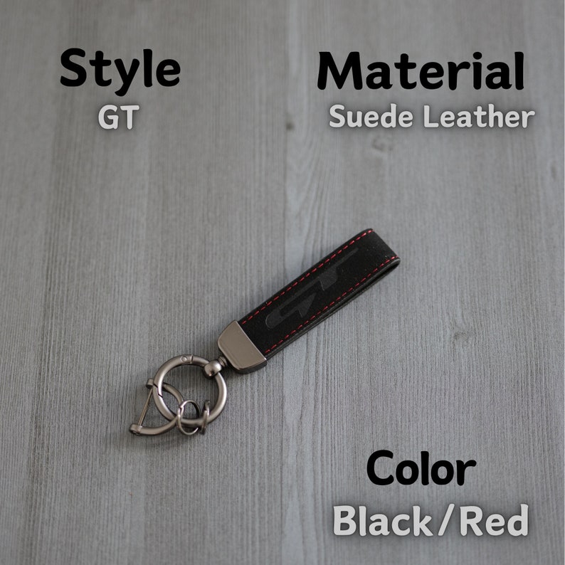 May include: Black suede leather keychain with a red stitched GT logo and a silver key ring.  Style: GT. Material: Suede Leather. Colour: Black/Red.