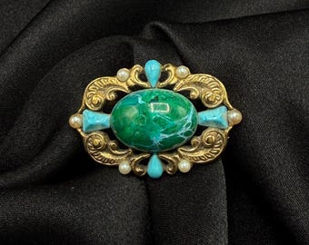 Vintage-Brosche aus dem Jahr 1928, goldfarben, mit grünen und blauen Steinen