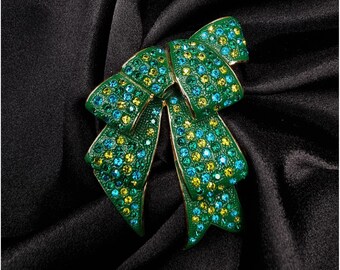 Vintage Joan Rivers jaren 90 groene en gele strass strik broche speld goudkleurig metaal elegante statement sieraden verzamelobject cadeau