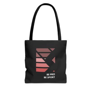 May include: Black tote bag with a pink geometric design and the text "BE PRO BE SPORT".