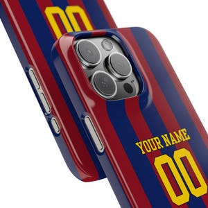 May include: A red and blue striped phone case with a yellow number "00" and the text "YOUR NAME".