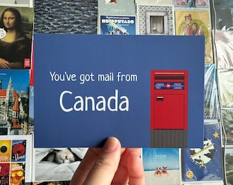 May include: A blue postcard with the text "You've got mail from Canada" and a red Canadian mailbox with the text "Canada Post" and "Postes Canada".