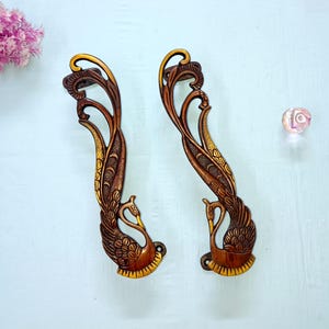 Dörrhandtag i mässing med dansande påfågel och öppna vingar - Set med 2 delar