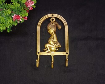 Perchero de pared de latón con diseño de princesa: Perchero con diseño de niña sentada