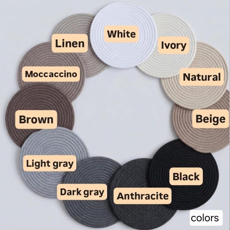 May include: A collection of round coasters in various colors, including white, ivory, natural, beige, linen, moccaccino, brown, light gray, dark gray, anthracite, and black. Each coaster is labeled with its color name. The word "colors" is in the bottom right corner.