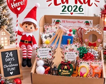 May include: An Elf Kit 2026 box containing various holiday-themed accessories, including a plush elf doll holding an I'm Here balloon, a chalkboard sign reading 24 Days of Christmas Fun, and assorted craft items like a wooden tree, snowman parts, and miniature decorations.