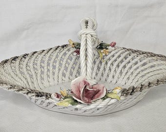 Vintage Bassano Italian Porcelain Woven Basket with handle. Dark pink and yellow rose detail with center floral design in center.