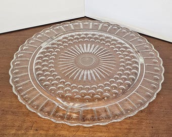 Vintage Federal Glass Footed Serving Plate / Cake Plate, Sunflower / sunburst pattern, Pressed / molded clear glass, Scalloped edges.