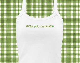 May include: White tank top with the text "Beer me, I'm Irish" and a green shamrock.