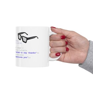 May include: White ceramic mug with a black and white image of a pair of glasses with a grid pattern. The mug has text that reads "Always 11:00 PM" and code that reads "all args) { string Variable wanted to say thanks"); Variable appreciate you");"